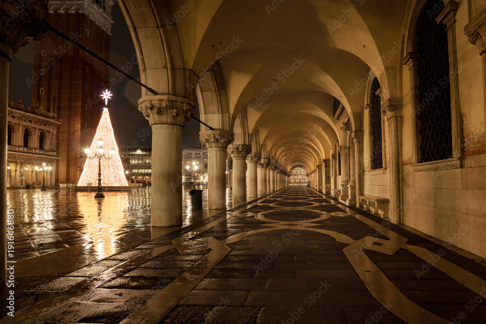 Venezia Piazza San Marco at rainy night with wetness reflections the most famous place in Venice Italy