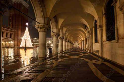 Venezia Piazza San Marco at rainy night with wetness reflections the most famous place in Venice Italy