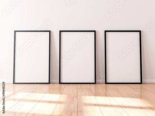 Fototapeta Naklejka Na Ścianę i Meble -  Three black Frames Mockup with poster canvas standing on wooden floor, 3d rendering