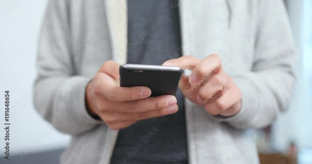 Man use of cellphone at home Man use of cellphone at home