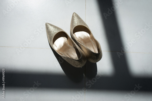 Golden bridal shoes. Wedding details. photo