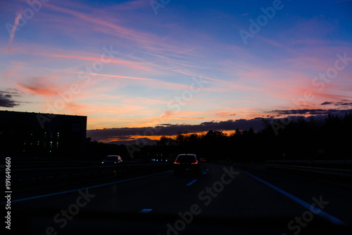 Fototapeta Naklejka Na Ścianę i Meble -  cars on the motorway at sunset