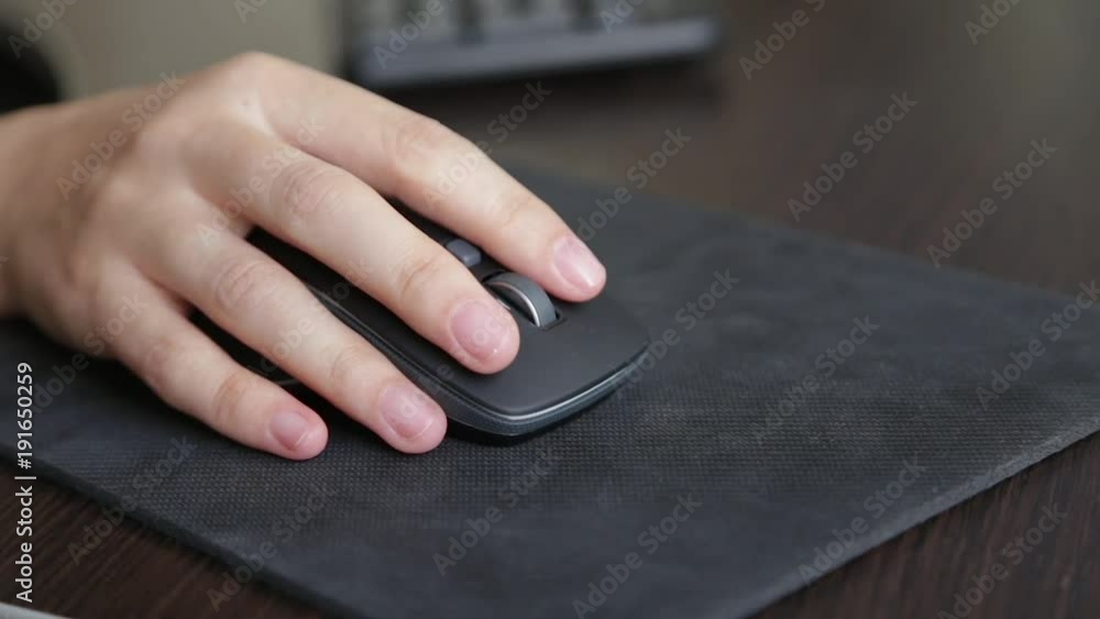 girl scrolling mouse, close-up, work in the office at the computer girl scrolling mouse, close-up, work in the office at the computer