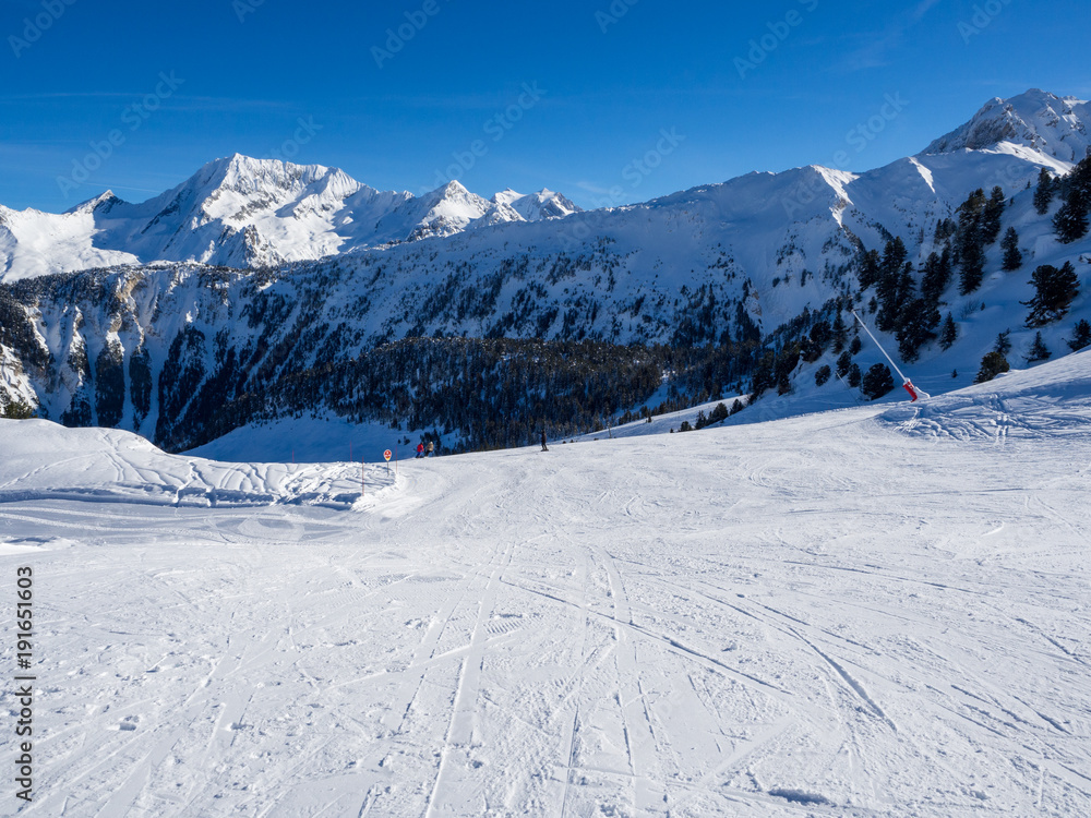 MERIBEL, FRANCE - JANUARY 2018: the white slopes in the Alps. Ski resort of Meribel, France. Sunny day MERIBEL, FRANCE - JANUARY 2018: the white slopes in the Alps. Ski resort of Meribel, France. Sunny day
