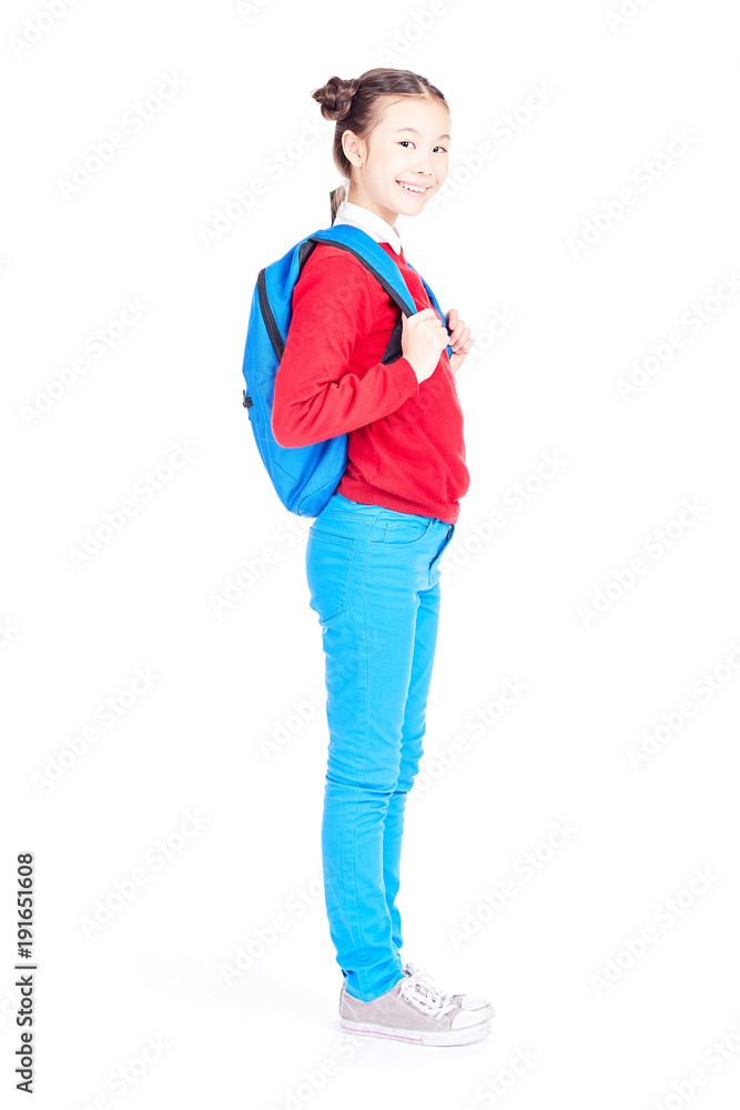 Studio portrait of schoolgirl posing with backpack on white background Studio portrait of schoolgirl posing with backpack on white background