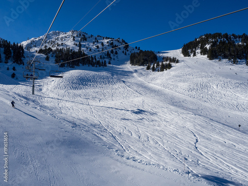 MERIBEL, FRANCE - JANUARY 2018: the white slopes in the Alps. Ski resort of Meribel, France. Sunny day
