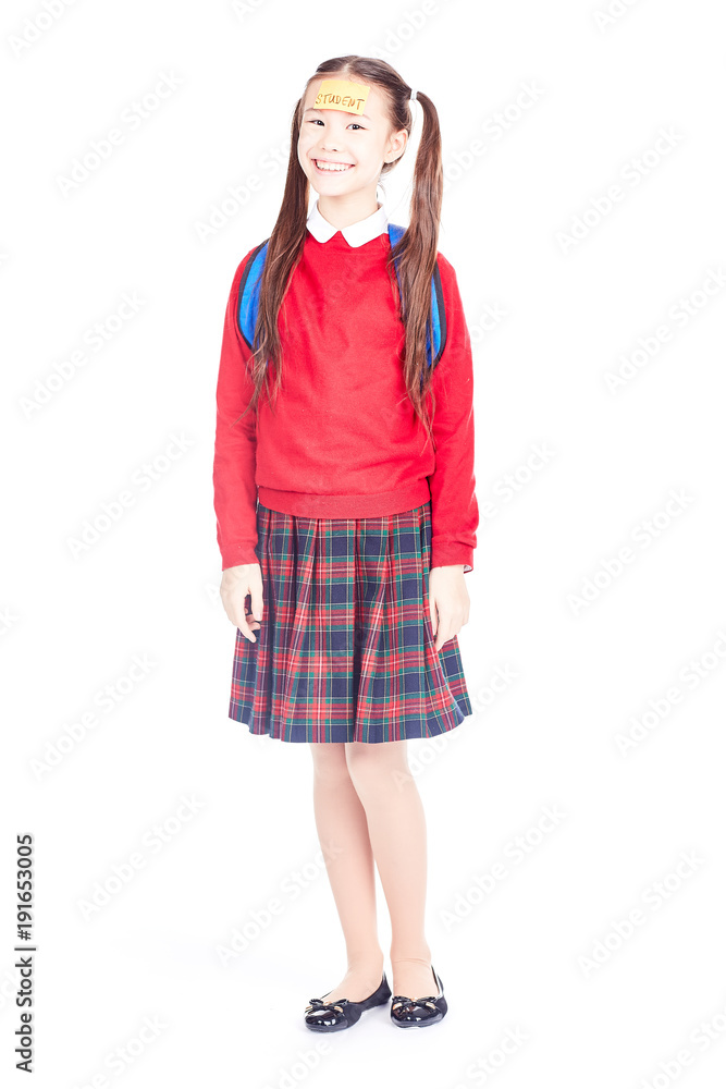 Fototapeta premium Asian female elementary student in school uniform posing on white background