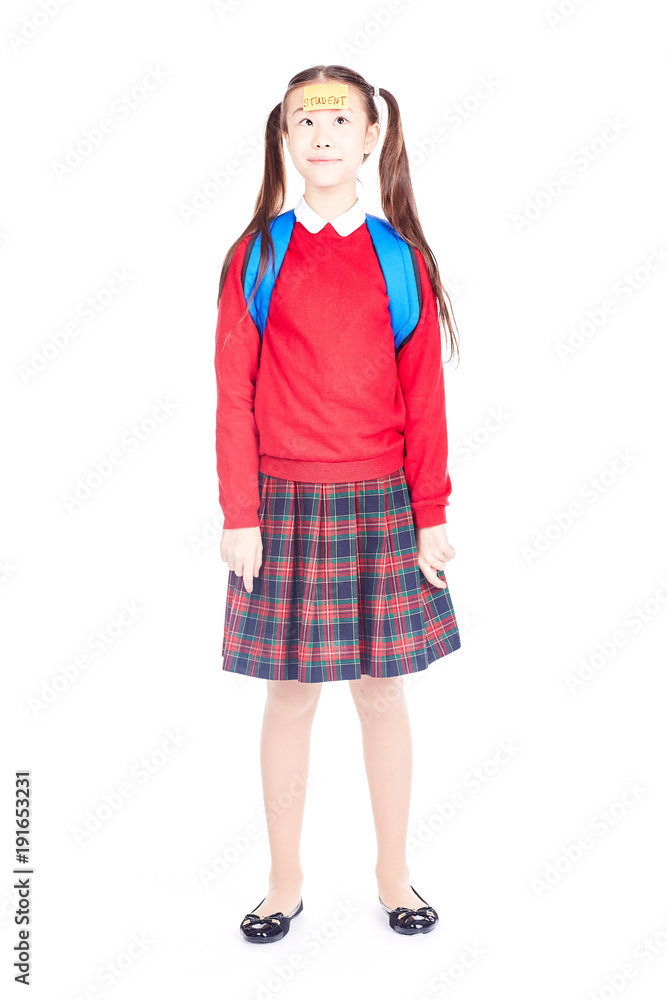 Fototapeta premium Asian female elementary student in school uniform posing on white background