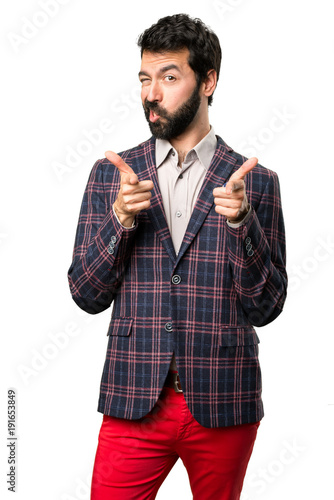 Well dressed man pointing to the front on white background