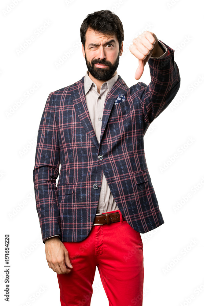 Well dressed man making bad signal on white background Well dressed man making bad signal on white background