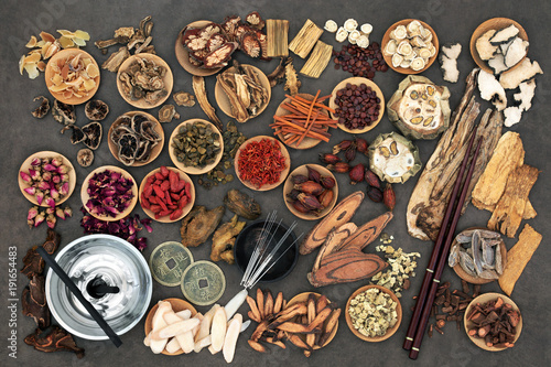 Fototapeta Naklejka Na Ścianę i Meble -  Chinese alternative medicine with herbs, acupuncture needles, moxa sticks used in moxibustion therapy and feng shui coins. Top view. 