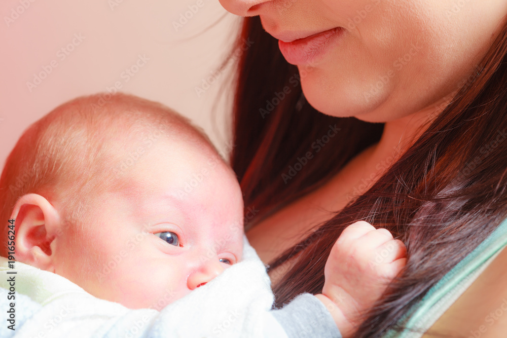 Mother holding her little newborn baby Mother holding her little newborn baby