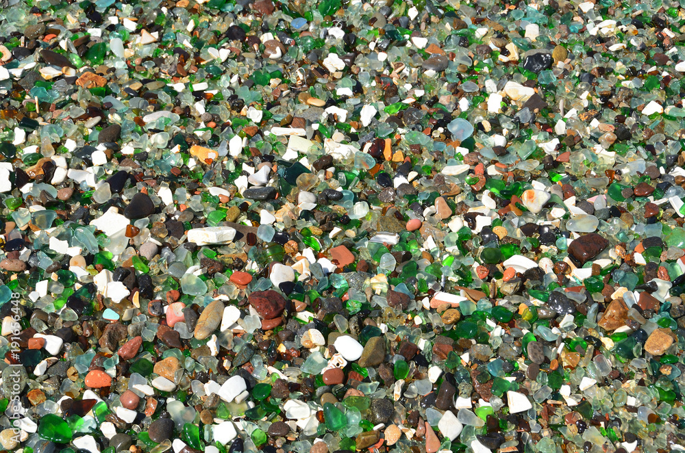 Background of glass pebbles. Steklyannaya (Glass) Bay near Vladivostok. Russia, Primorsky Krai Background of glass pebbles. Steklyannaya (Glass) Bay near Vladivostok. Russia, Primorsky Krai