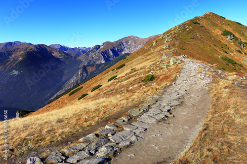 Poland, Tatra Mountains, Zakopane - Posredni Wierch Goryczkowy peak, Tomanowa Liptowska Valley and Czerwone Wierchy peaks with Western Tatra in background