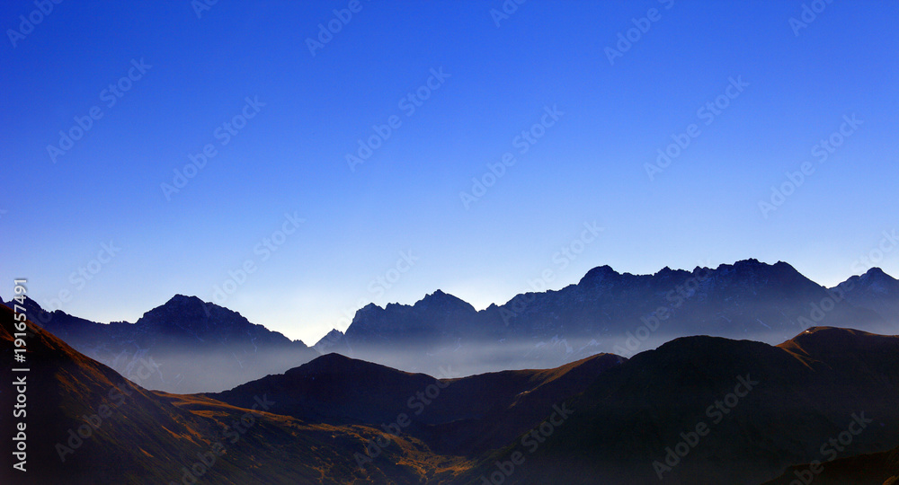 Poland, Tatra Mountains, Zakopane - Wierchcicha Valley and Cichy Wierch, Zadnia Garajowa Kopa peaks with High Tatra in background