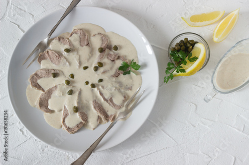 Obraz na płótnie Vitello tonnato is a traditional italian dish on a white concrete background. w salonie