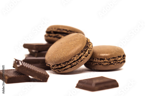 chocolate or coffee taste french macaroons isolated on white background, selective focus