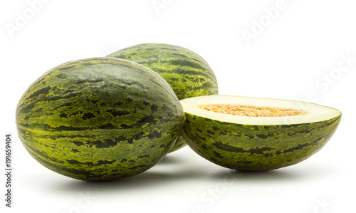 Two melons Piel de Sapo with one section half (Santa Claus Christmas variety) isolated on white background green striped outer rind.