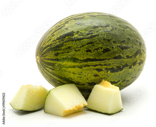 фотографія One melon Piel de Sapo with three cut pieces (Santa Claus Christmas variety) isolated on white background green striped outer rind