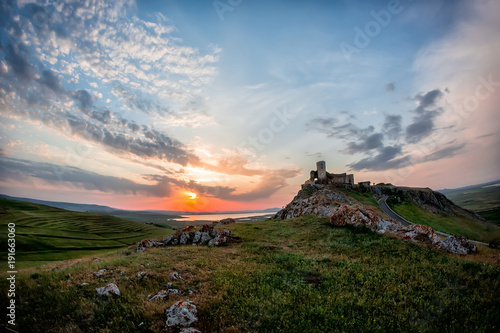 Beautiful landscape and a sunset sky over Enisala old stronghold citadel,Dobrogea,Romania