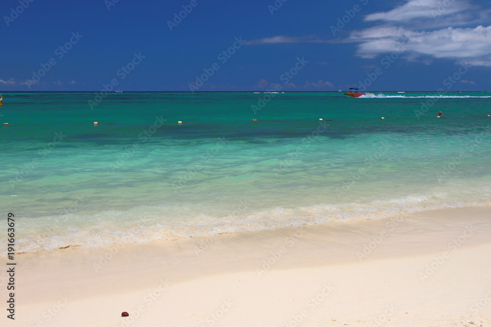 Bathing zone on sandy beach in tropics. Trou aux Biches, Mauritius