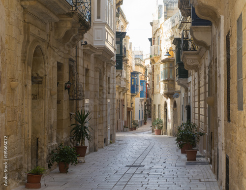 Empty street between traditional houses in the city of Vittoriosa, Three Cities, Malta