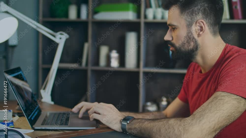 Student searching internet on laptop in office. Businessman working on laptop pc in home. Business man looking at notebook and typing keyboard. Business owner using laptop computer Student searching internet on laptop in office. Businessman working on laptop pc in home. Business man looking at notebook and typing keyboard. Business owner using laptop computer