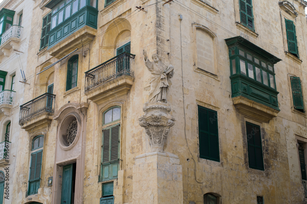 Statue on the corner of streets in the city of Senglea, Three Cities, Malta