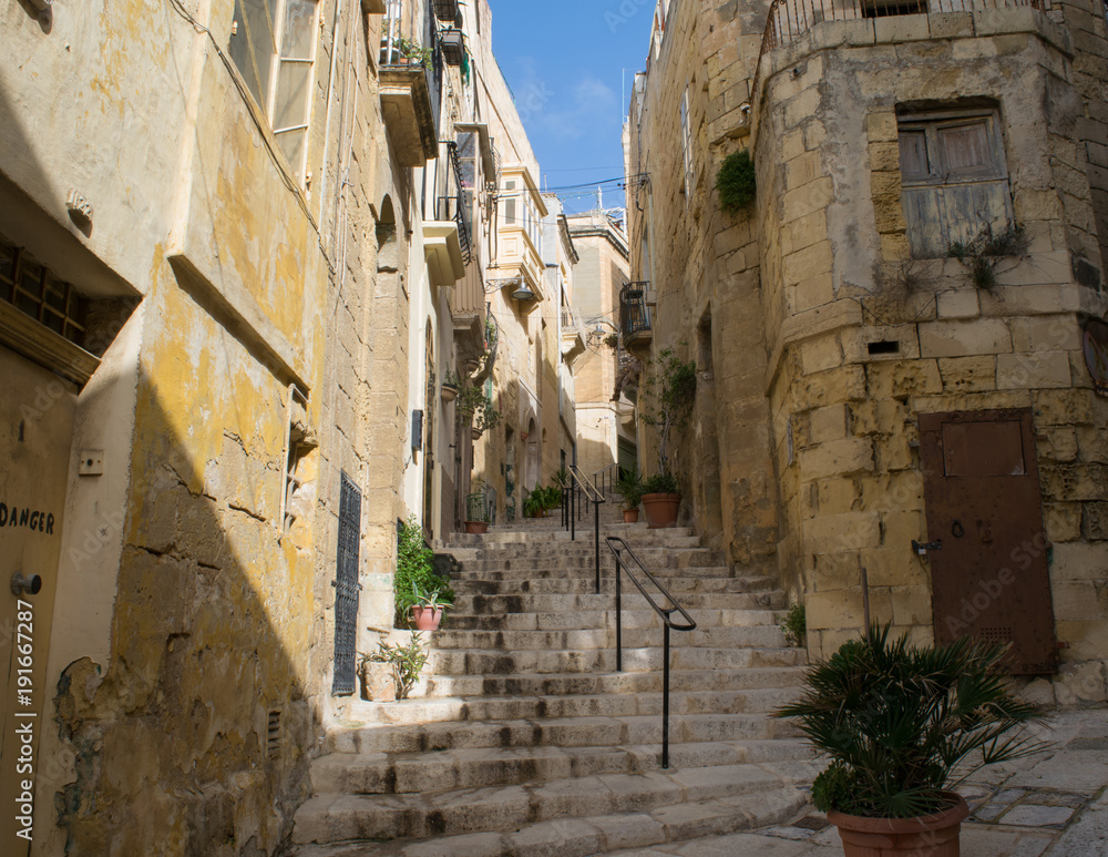 Empty stairway between traditional houses in the city of Vittoriosa, Three Cities, Malta