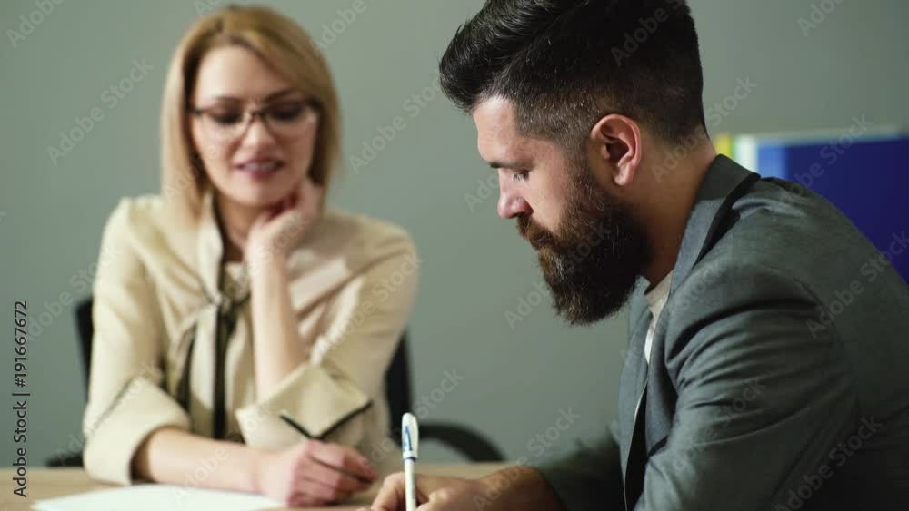 Office flirt - attractive woman flirting over desk with her coworker. Office play around. Job interview Office flirt - attractive woman flirting over desk with her coworker. Office play around. Job interview