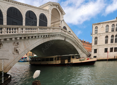 Rialto bridge in Venice with the vaporetto moving on the Grand Canal