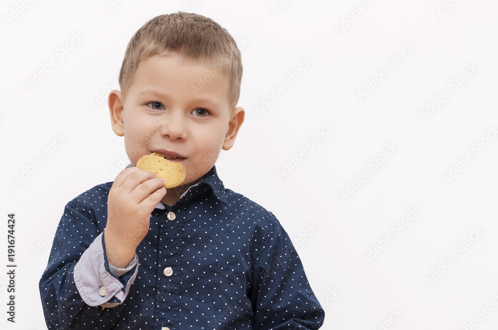 Little boy eating a biscuit Little boy eating a biscuit