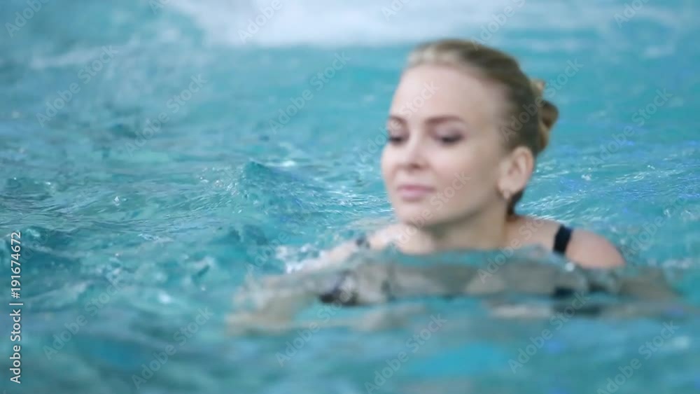 beautiful girl swims in the pool beautiful girl swims in the pool