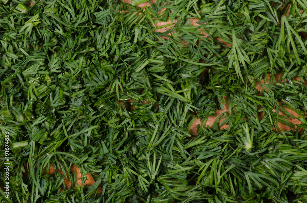 Dill chopped on a wooden board macro Dill chopped on a wooden board macro