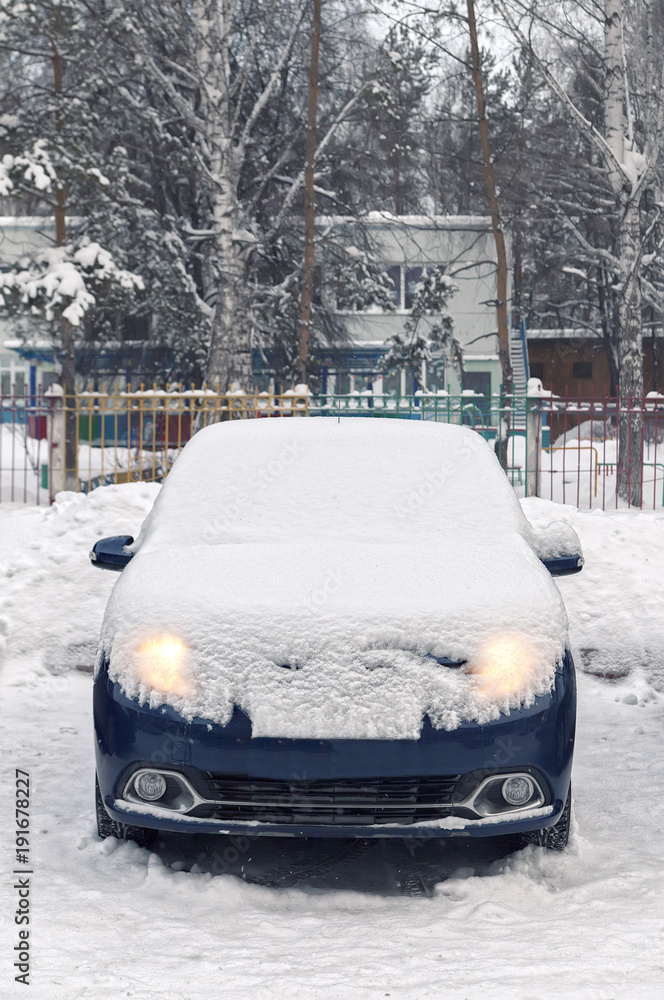 car is covered with snow