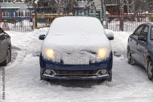 car is covered with snow