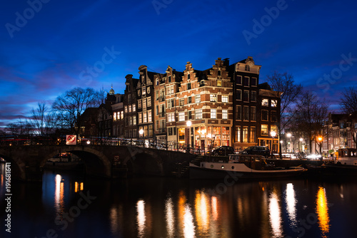 Amsterdam canal houses illuminated at dusk