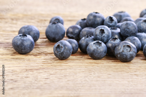 Blueberries on wooden background, copy space.