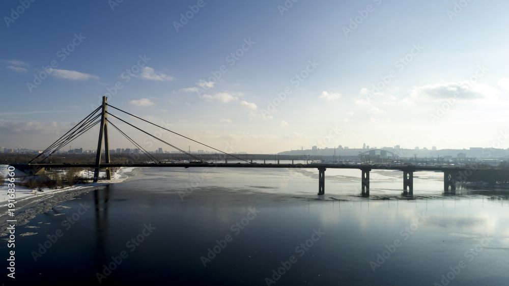 Landscape with suspension Moscow Bridge across the Dnieper river, Obolon, Kiev, Ukraine