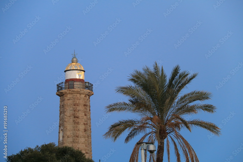 Lighthouse Punta Doncella, located next to the seaport of Estepona, on the Costa del Sol, province of Malaga, Andalusia, southern Spain.