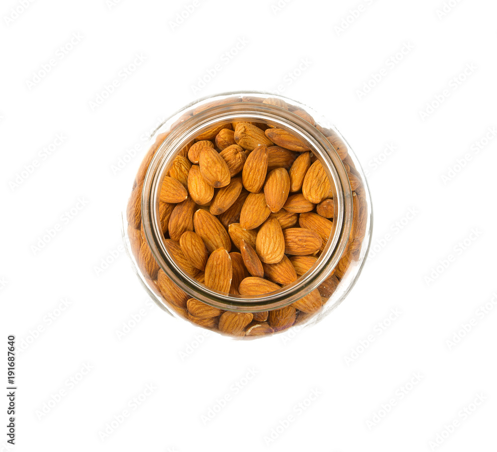 almonds in a glass jar isolated almonds in a glass jar isolated