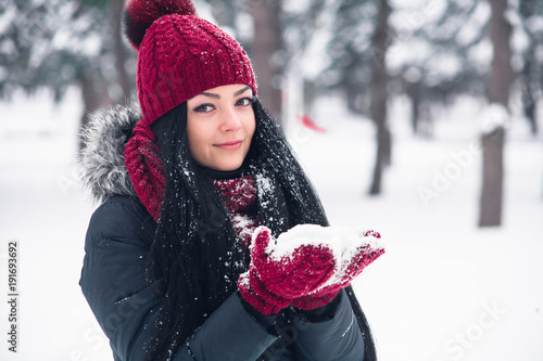 Young woman rushes with snow photo