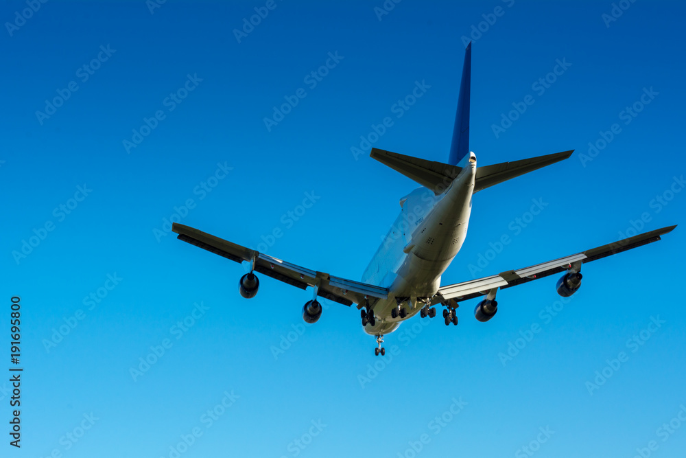 Obraz premium Horizontal View of Close Up of a Cargo Airplane in the Landing Operation in The Morning. Grottaglie, Taranto, South of Italy
