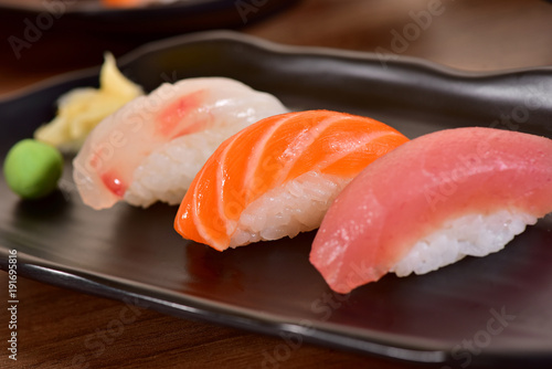 Salmon and Tuna Nigiri Sushis on restaurant table