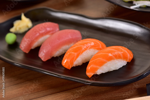 Salmon and Tuna Nigiri Sushis on restaurant table