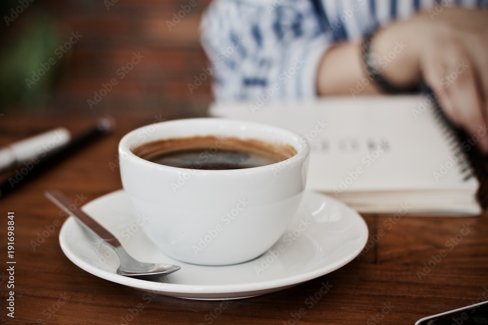 Coffee cup hot in the morning and working at cafe Coffee cup hot in the morning and working at cafe