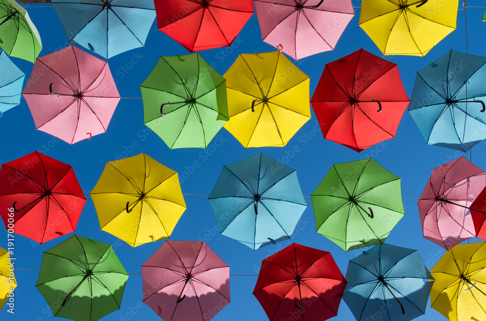 Umbrellas against bright blue sky Umbrellas against bright blue sky