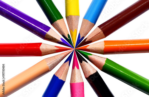 Colored pencils - flower shape. Children colored pencils piled around a central point. photo