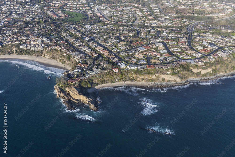 Aerial view of Mussel Cove area beaches, streets and homes in Dana Point California.