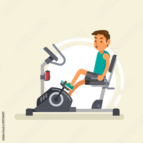 a man riding recumbent exercise bike
